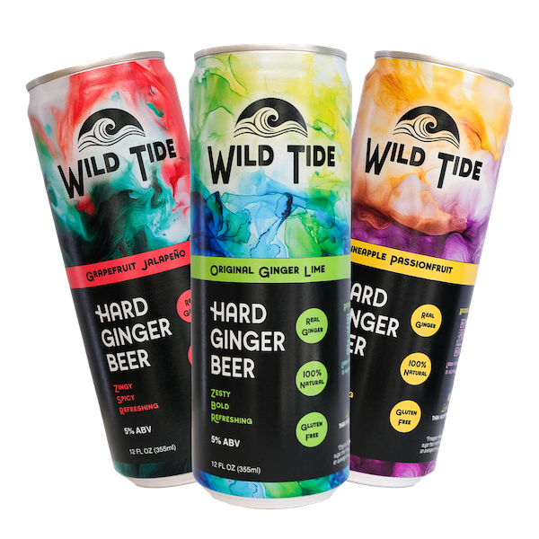 Three cans of Wild Tide ginger beer, transparent background. One can each of Original, Pineapple Passionfruit, and Grapefruit Jalapeño.